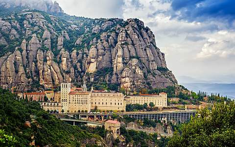 The monastery of Santa Maria de Montserrat, nestled in the mountains